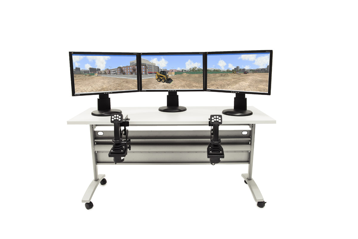 Tabletop Setup with 3 Displays – Panoramic View Three-monitor tabletop configuration for the Skid Steer Loader simulator with replica controls